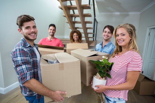 Professional movers handling equipment in Harringay