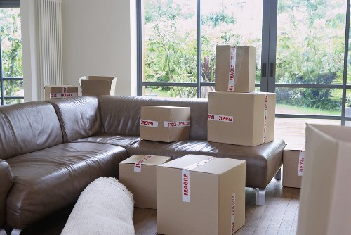 Team of expert movers handling bulky furniture in Harringay